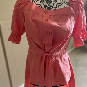 Off the shoulder shirt. High front long back.